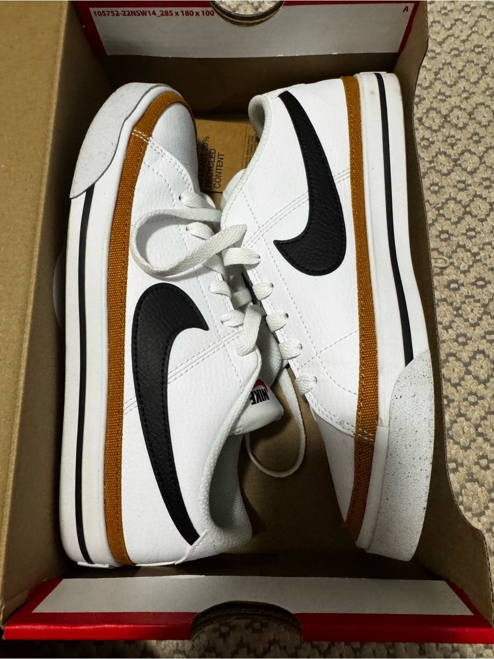Nike White Leather Sneakers with Black Swoosh and Tan Stripe